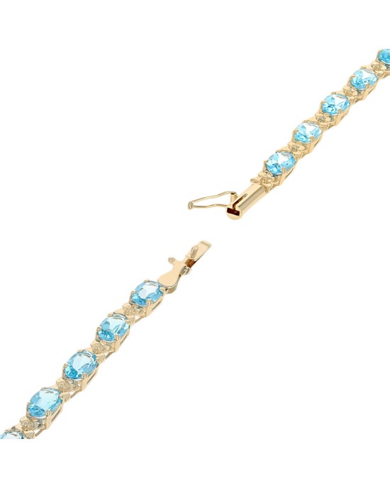 Alternating Swiss Blue Topaz and Flower Link Inline Bracelet in Yellow Gold